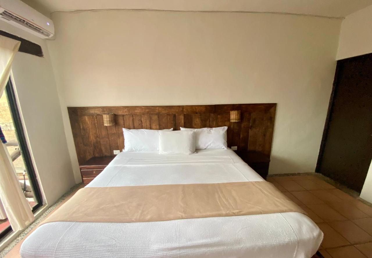 Casa Caribe Канкун Экстерьер фото A bedroom at the hotel